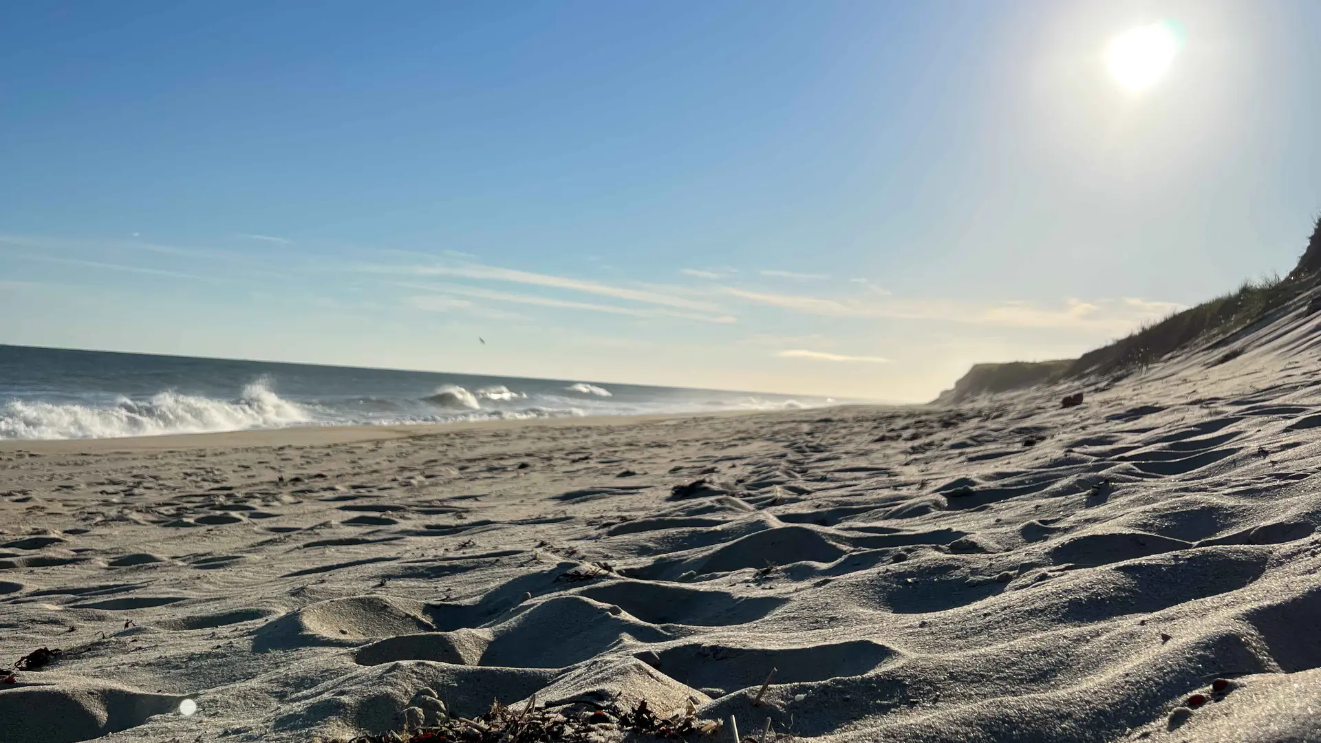 Surf breaking along the beach at Miacomet, Nantucket, below the south-shore bluff