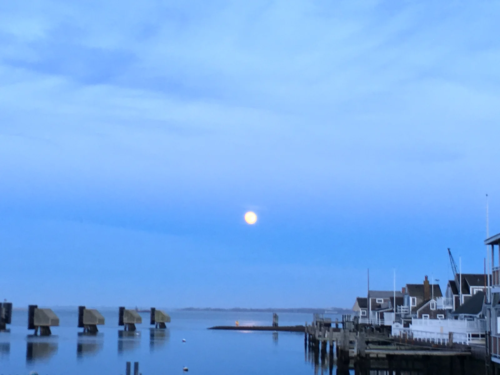 Moonrise over Nantucket harbor on a clear winter night