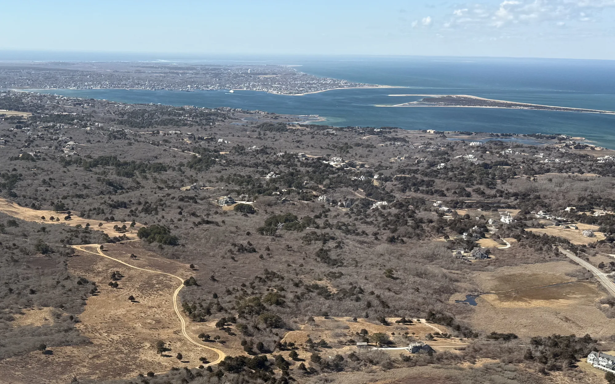 Aerial view over the Quaise moors toward Nantucket Harbor, town, and Coatue